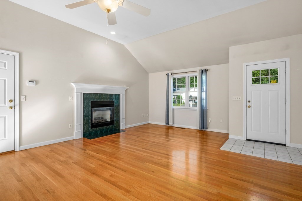 21 Micah Hamlin Road Centerville, MA 02632 - Photo 3 of 42 a view of an empty room with wooden floor fireplace and a window