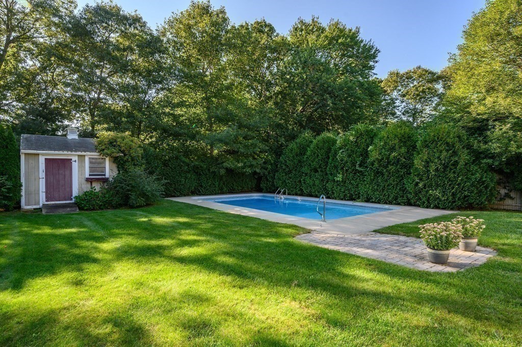 21 Micah Hamlin Road Centerville, MA 02632 - Photo 37 of 42 a view of a backyard with a garden