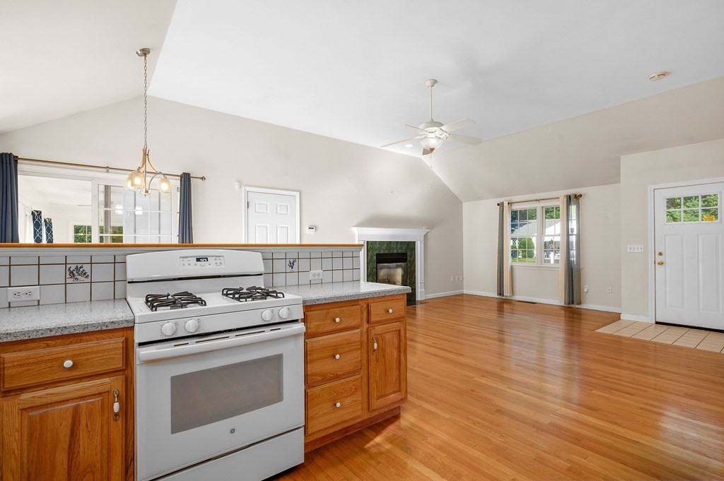 21 Micah Hamlin Road Centerville, MA 02632 - Photo 7 of 42 a kitchen with a stove cabinets and wooden floor