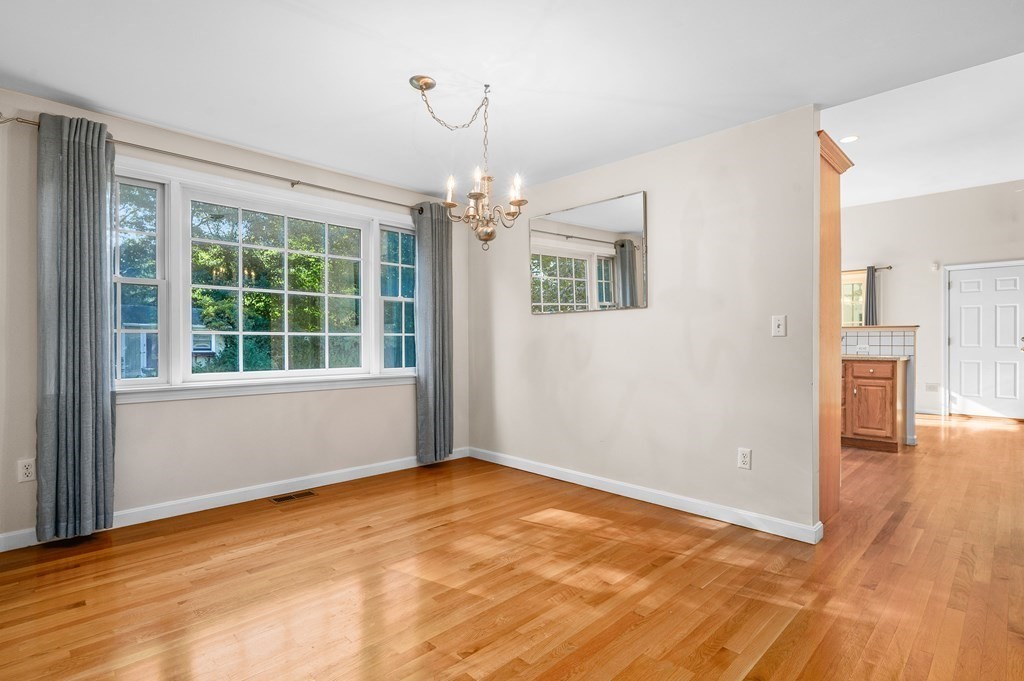 21 Micah Hamlin Road Centerville, MA 02632 - Photo 10 of 42 a view of an empty room with a window and wooden floor