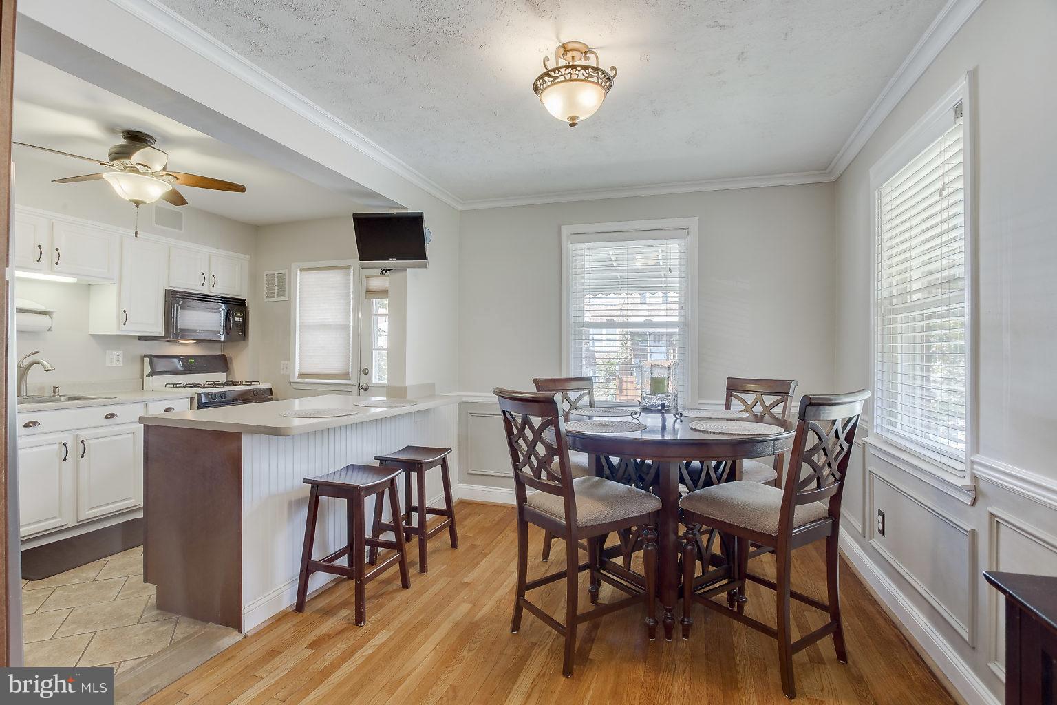 8626 Oak Road Baltimore, MD 21234 - Photo 2 of 30 a view of a dining room with furniture window and wooden floor