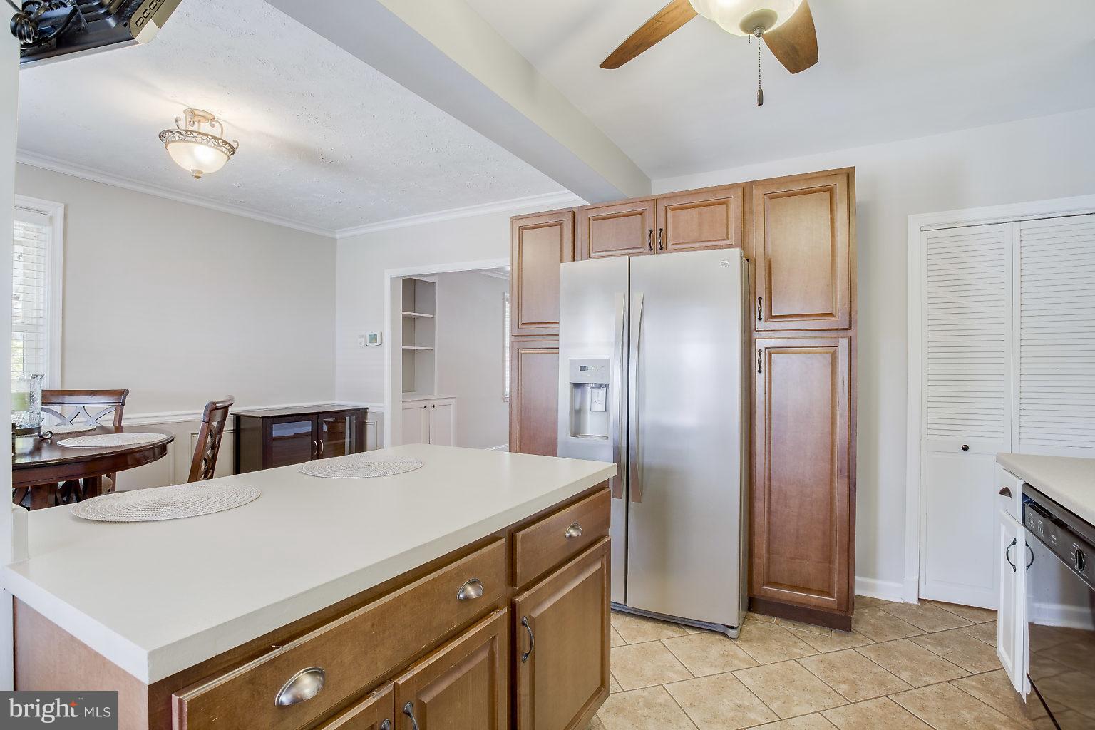 8626 Oak Road Baltimore, MD 21234 - Photo 13 of 30 a kitchen with stainless steel appliances a refrigerator and a stove