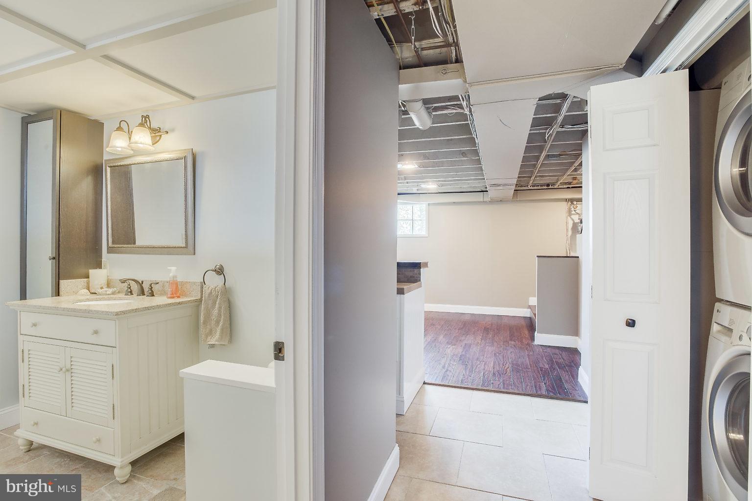 8626 Oak Road Baltimore, MD 21234 - Photo 21 of 30 a bathroom with a sink a toilet and mirror