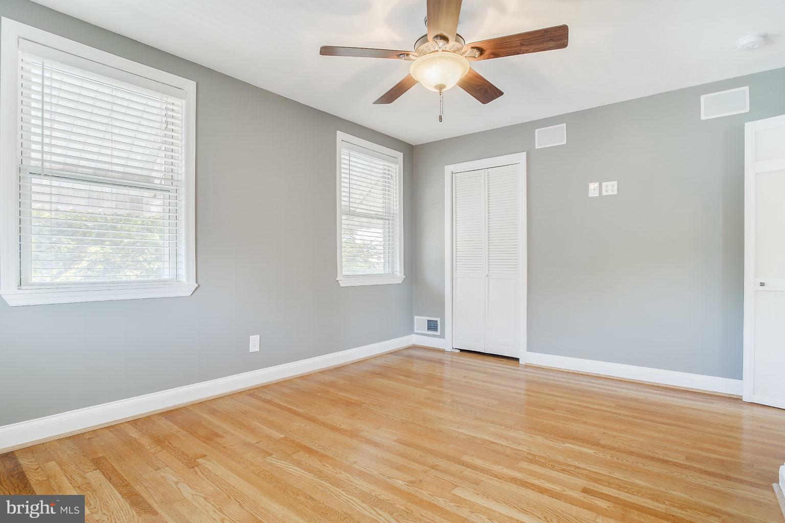 8626 Oak Road Baltimore, MD 21234 - Photo 22 of 30 a view of an empty room with wooden floor and a window