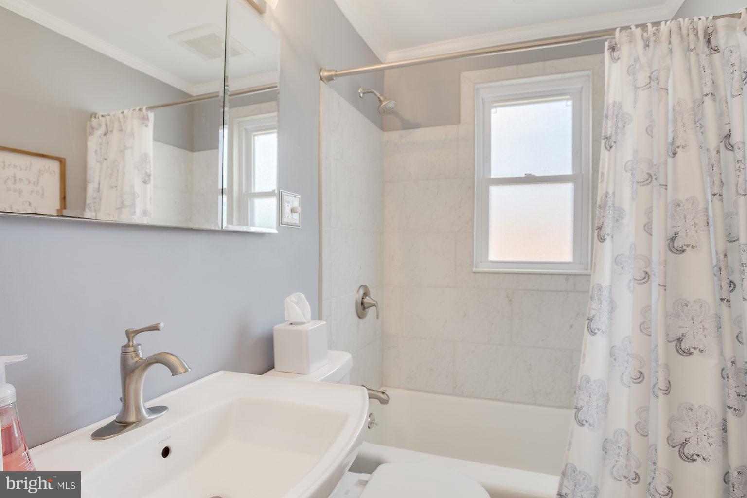 8626 Oak Road Baltimore, MD 21234 - Photo 24 of 30 a bathroom with a sink a toilet and shower