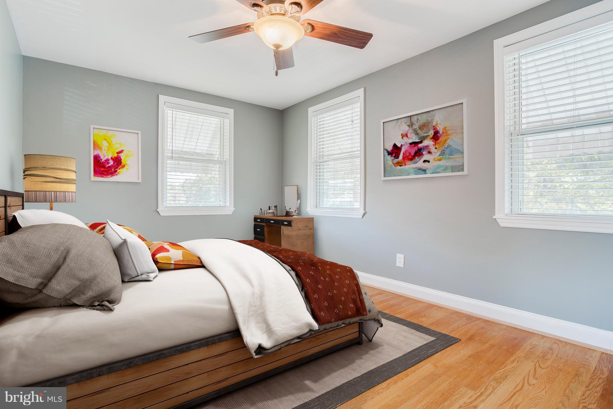 8626 Oak Road Baltimore, MD 21234 - Photo 4 of 30 a bedroom with a bed and a chandelier