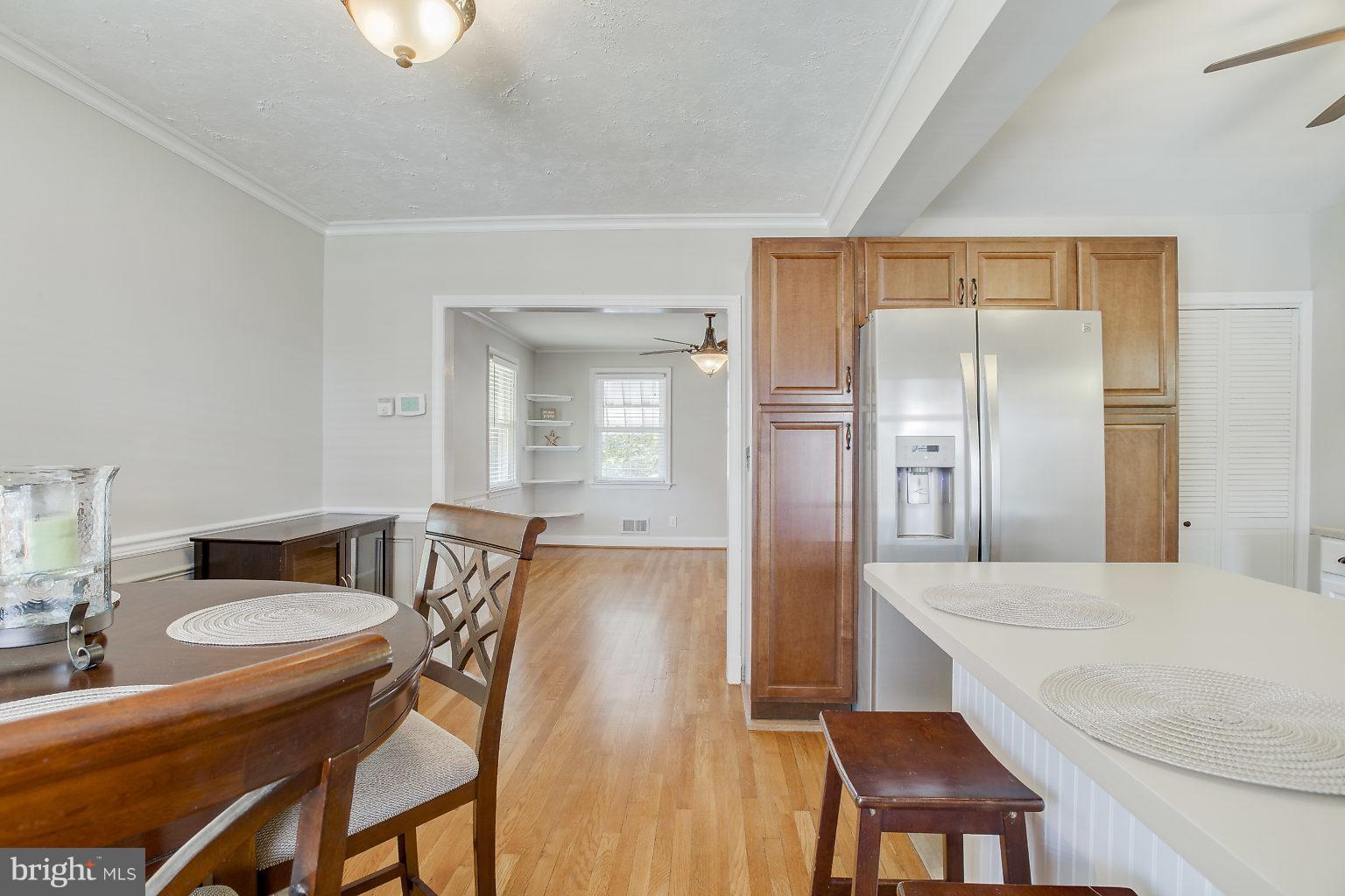 8626 Oak Road Baltimore, MD 21234 - Photo 10 of 30 a kitchen with a table and chairs in it