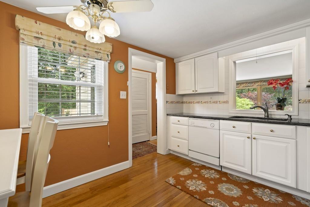 56 Ledgewood Road Dedham, MA 02026 - Photo 13 of 36 a kitchen with granite countertop cabinets a window and a sink