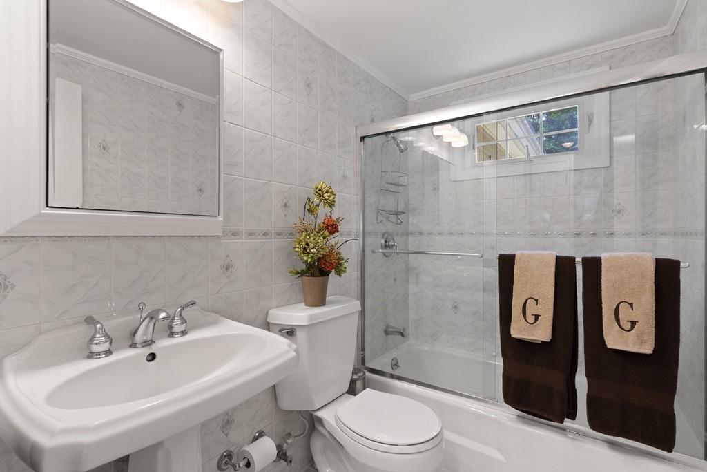 56 Ledgewood Road Dedham, MA 02026 - Photo 18 of 36 a bathroom with a toilet sink and shower