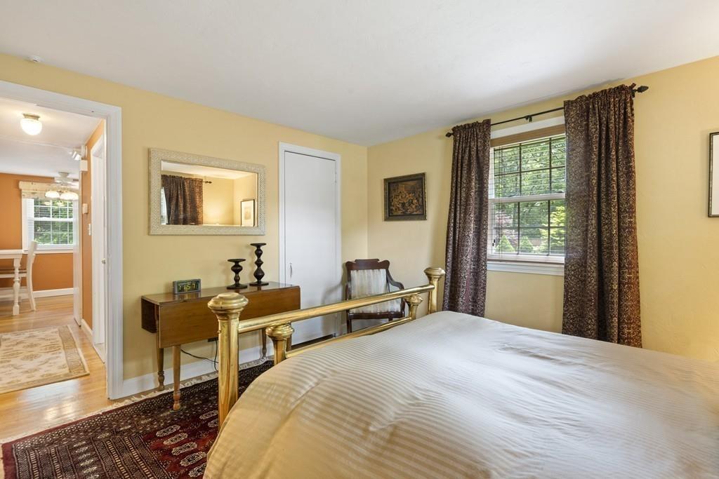 56 Ledgewood Road Dedham, MA 02026 - Photo 19 of 36 a bedroom with a bed and wooden floor