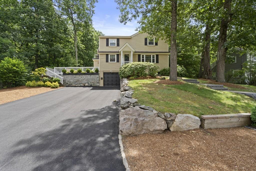 56 Ledgewood Road Dedham, MA 02026 - Photo 2 of 36 a front view of a house with a yard
