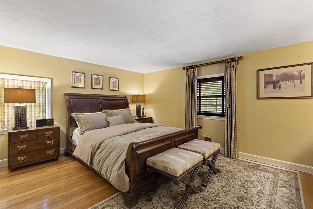 56 Ledgewood Road Dedham, MA 02026 - Photo 25 of 36 a bedroom with a bed and a painting on the wall
