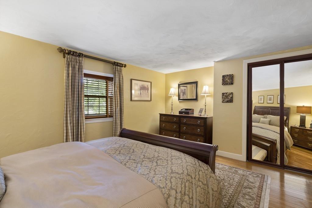 56 Ledgewood Road Dedham, MA 02026 - Photo 26 of 36 a bedroom with a bed and wooden floor
