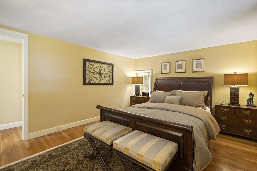 56 Ledgewood Road Dedham, MA 02026 - Photo 27 of 36 a bedroom with a bed and wooden floor