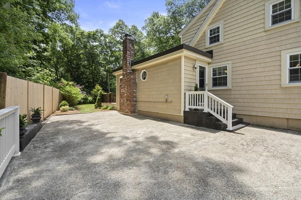 56 Ledgewood Road Dedham, MA 02026 - Photo 34 of 36 a view of a house with a yard and garage