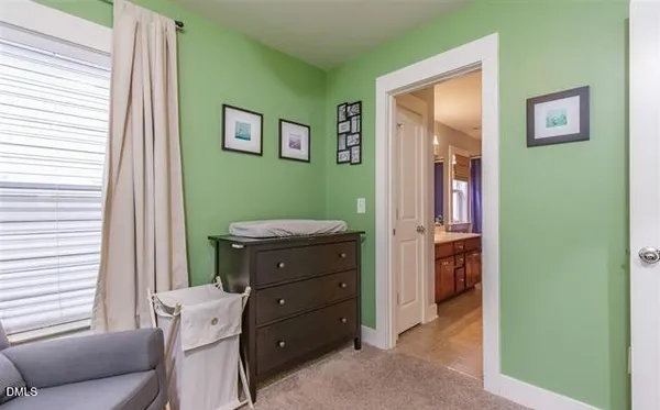 a room that has a dresser and a window