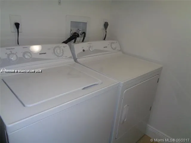 a living room with lots of furniture and a large window