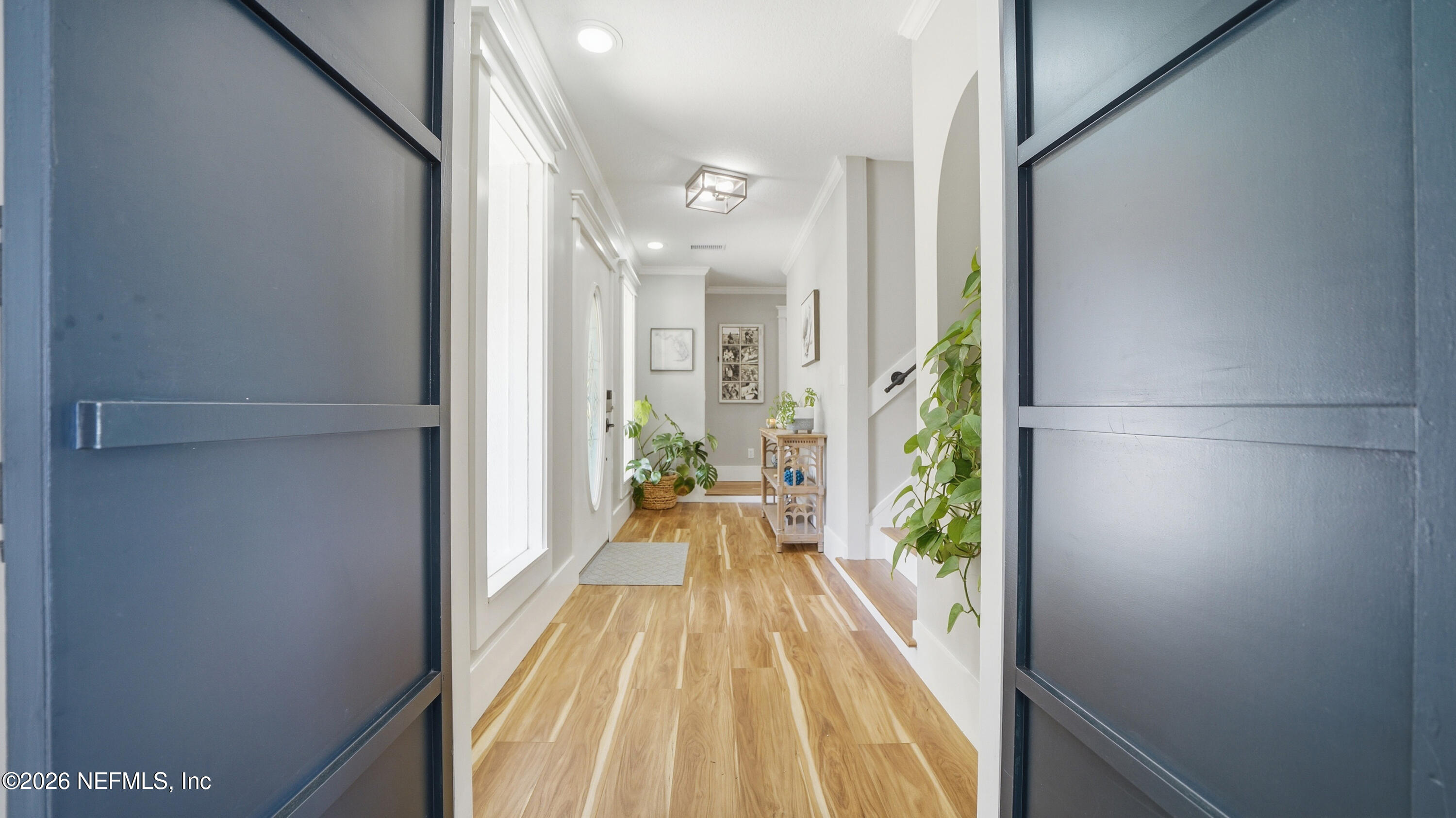 1703 Pelican Place Middleburg, FL 32068 - Photo 20 of 99 a view of a hallway with wooden floor and staircase
