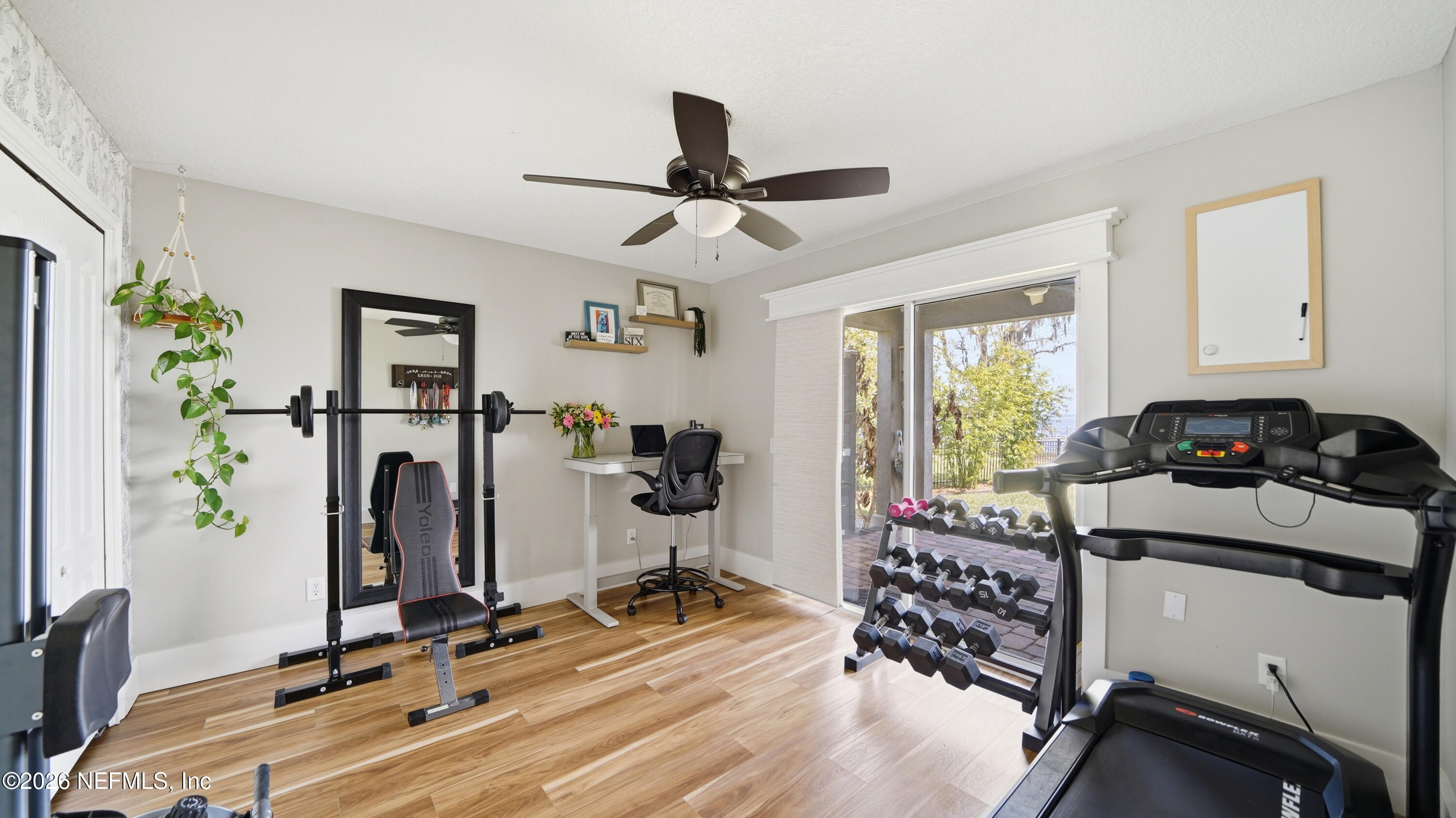 1703 Pelican Place Middleburg, FL 32068 - Photo 28 of 99 a room with gym equipment and a window