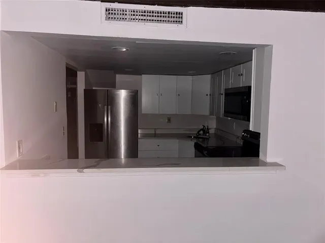 a large bathroom with a large mirror