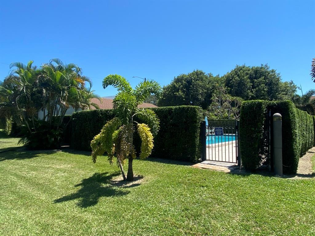 4761 Northwest 2nd Avenue, Unit 307 Boca Raton, FL 33431 - Photo 5 of 15 a backyard of a house with entertaining space