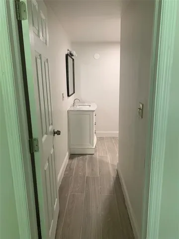 a view of a storage and utility room with a sink