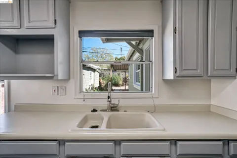 a kitchen with granite countertop a stove and a refrigerator