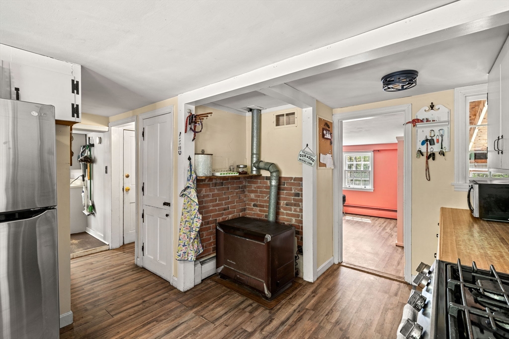 600 Main Street Ashby, MA 01431 - Photo 7 of 40 a kitchen with stainless steel appliances granite countertop a refrigerator and a stove top oven