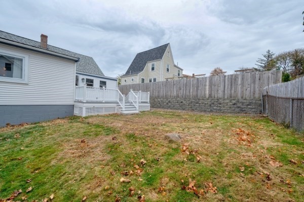 7 Weyham Road Weymouth, MA 02191 - Photo 11 of 38 a view of a house with a wooden fence