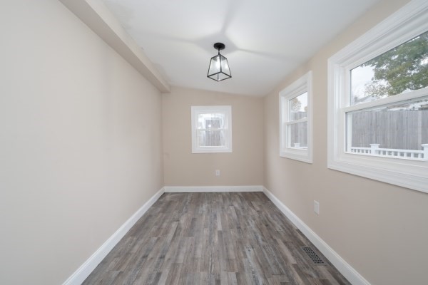 7 Weyham Road Weymouth, MA 02191 - Photo 17 of 38 wooden floor in an empty room with a window
