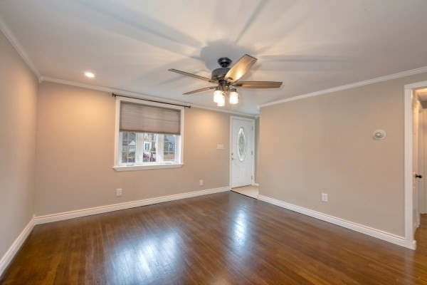 7 Weyham Road Weymouth, MA 02191 - Photo 18 of 38 a view of an empty room with wooden floor and a window