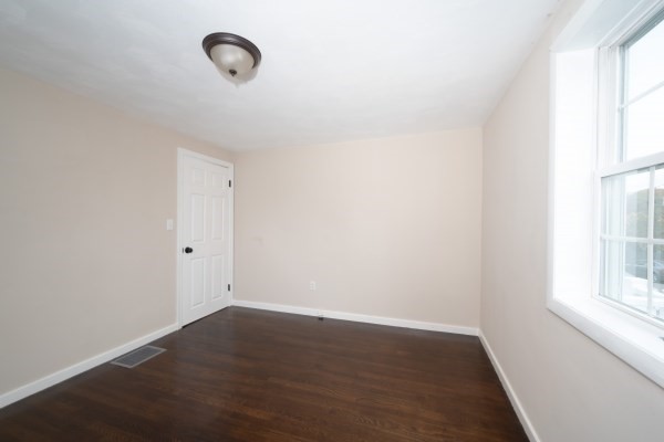 7 Weyham Road Weymouth, MA 02191 - Photo 21 of 38 a view of a room with wooden floor and window