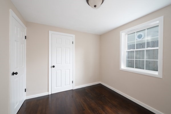 7 Weyham Road Weymouth, MA 02191 - Photo 22 of 38 a view of an empty room with wooden floor and a window