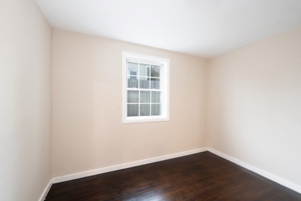 7 Weyham Road Weymouth, MA 02191 - Photo 23 of 38 an empty room with wooden floor and windows
