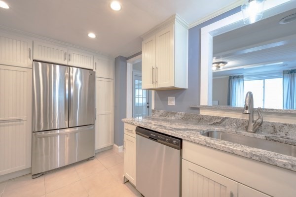 7 Weyham Road Weymouth, MA 02191 - Photo 3 of 38 a kitchen with stainless steel appliances granite countertop a refrigerator and a sink