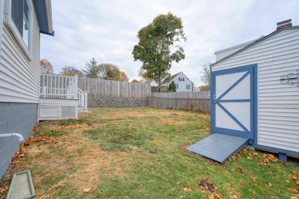 7 Weyham Road Weymouth, MA 02191 - Photo 8 of 38 a view of backyard with wooden fence