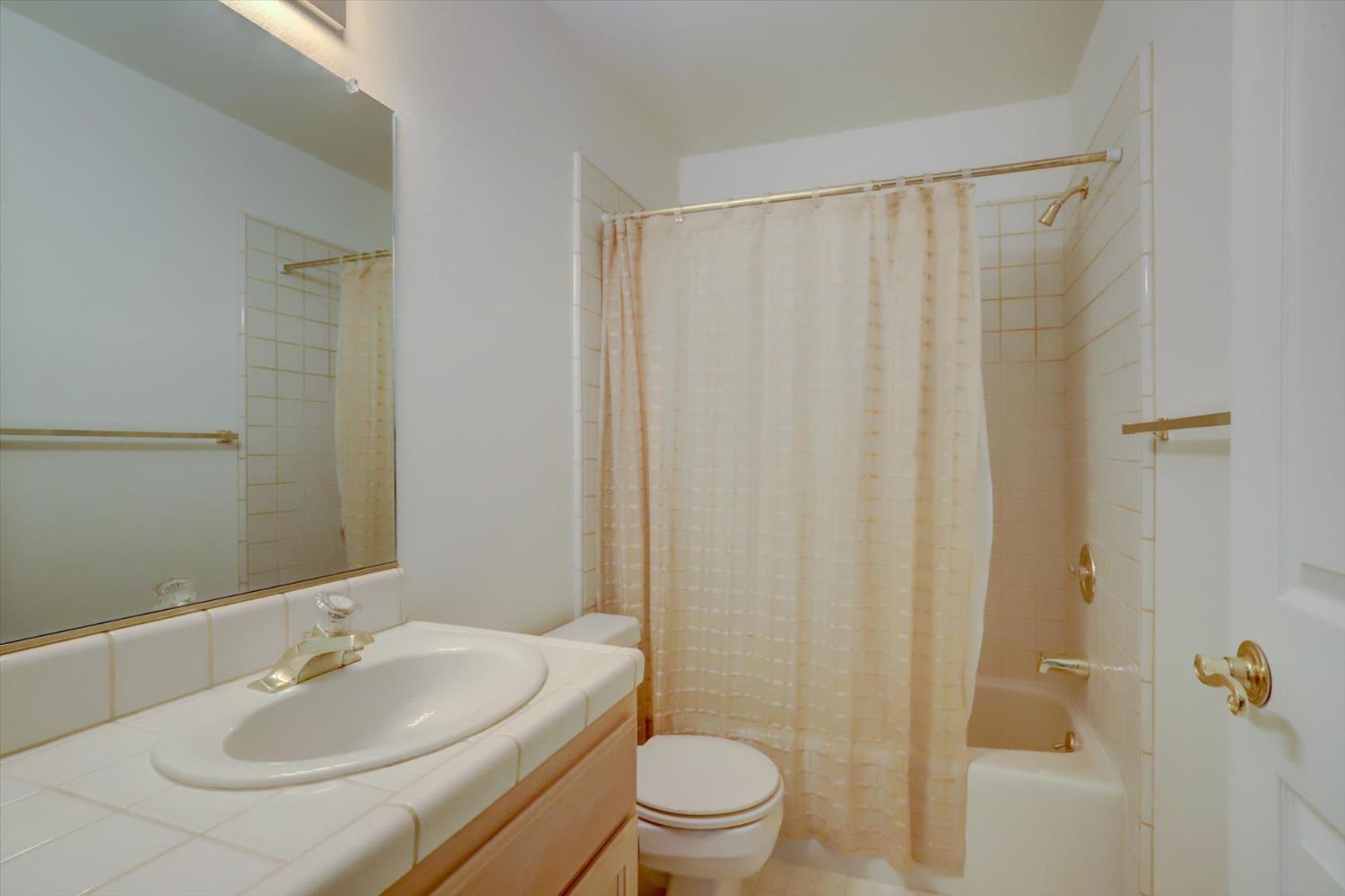 16479 Brewer Road Grass Valley, CA 95949 - Photo 14 of 33 a bathroom with a sink toilet and shower