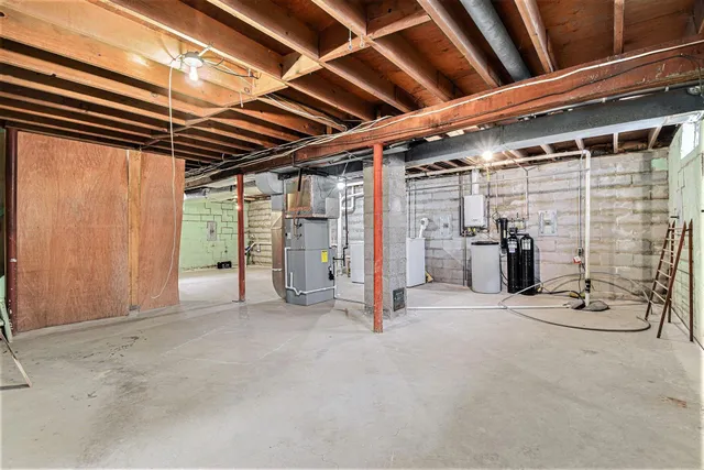 a view of an empty room with wooden walls