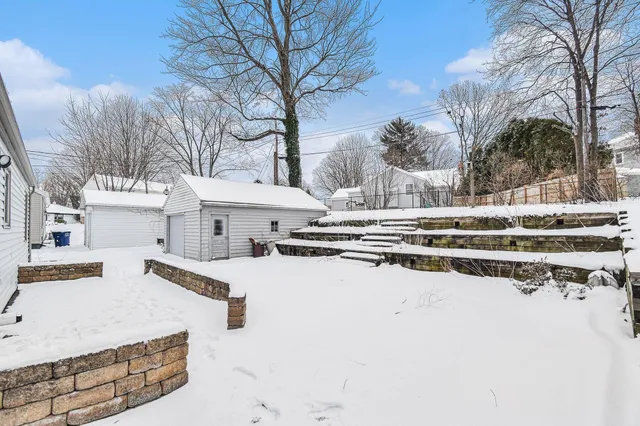 a view of a building with trees in the background
