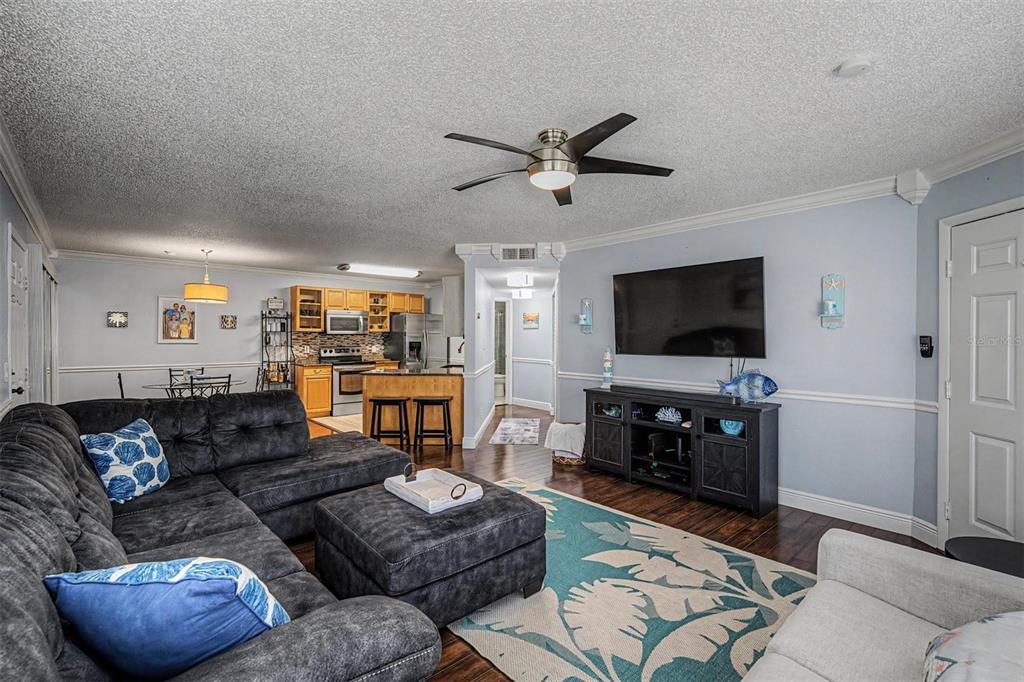 1550 South Belcher Road, Unit 525 Clearwater, FL 33764 - Photo 8 of 28 a living room with furniture and a flat screen tv