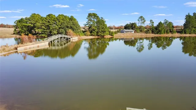 a view of a lake with houses in the background