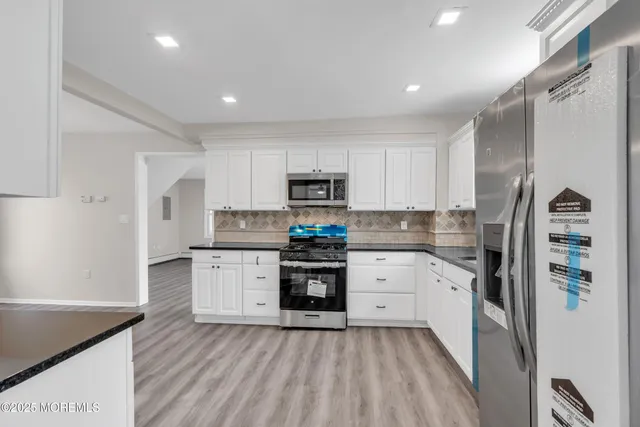 a bathroom with a shower toilet and sink