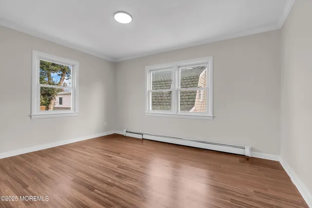 a view of a park with wooden fence
