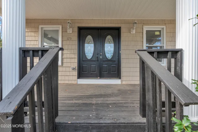a view of backyard with a deck