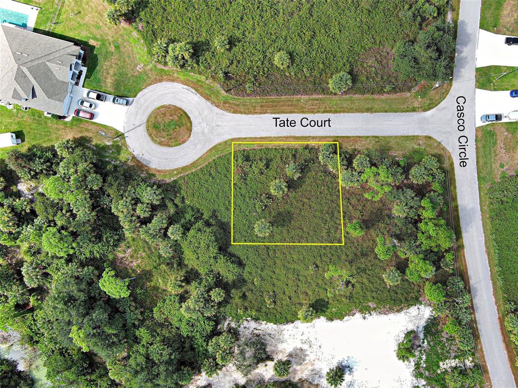 Tate Ct Port North Port, FL 34288 - Photo 3 of 4 a sign that is on a wooden wall