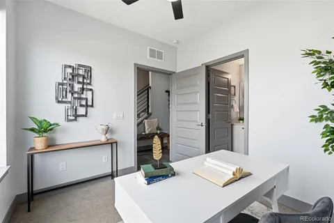 a view of a workspace with furniture