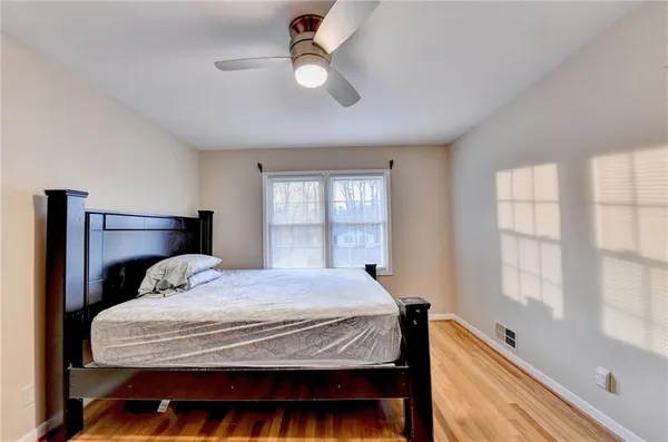 a bedroom with a bed and window