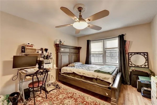 a bed room with a bed and a chair