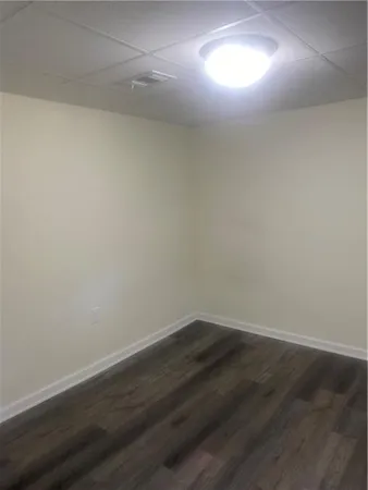 a white toilet sitting next to a bath tub