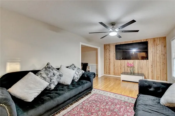 a living room with furniture and a window